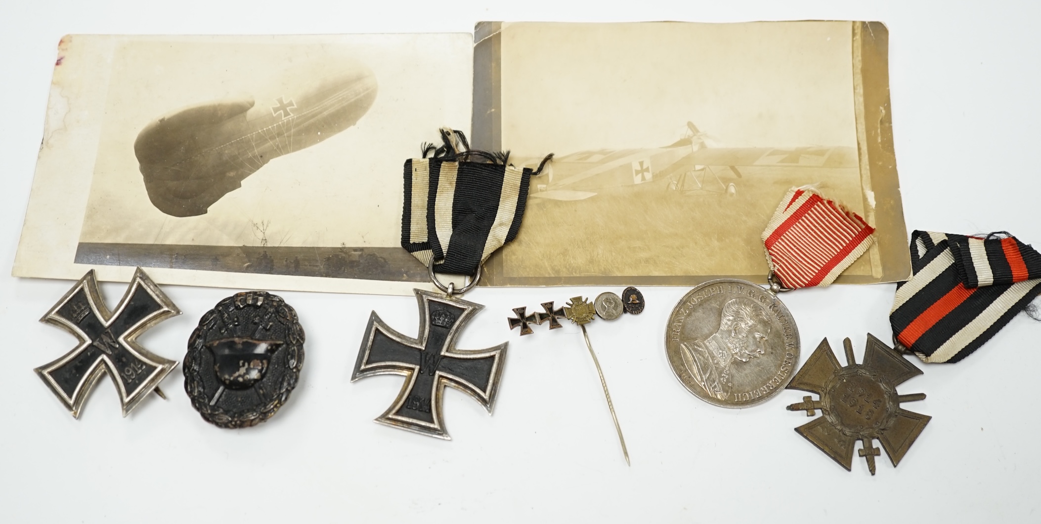 Four First World War German medals; a First Class Iron Cross, a 2nd Class Iron Cross, a 1914-1918 Honour Cross and an Austro-Hungarian Medal for Bravery, together with a wound badge and the related stick pin for the meda